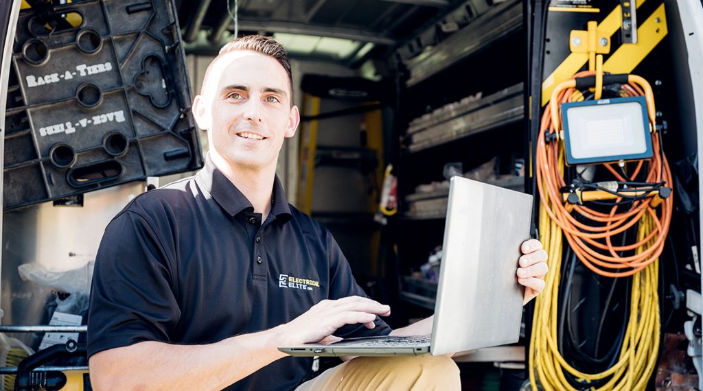 Elite electrician with laptop